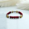 Bracelet en pierre de corail rouge et calcite jaune. Confiance en soi, intuition et détermination.